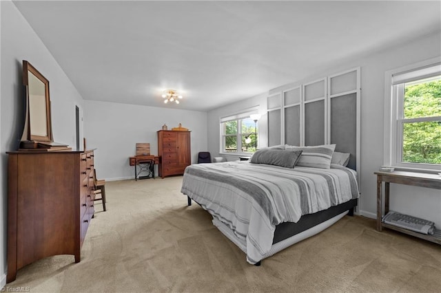 1805 Guilford College Rd, Jamestown, NC 27282 - bedroom featuring light carpet and baseboards