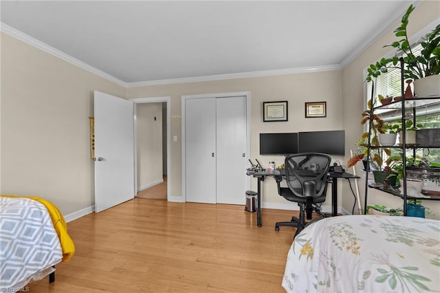 1805 Guilford College Rd, Jamestown, NC 27282 - bedroom featuring light wood-style floors, crown molding, and baseboards