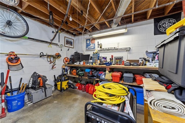 1805 Guilford College Rd, Jamestown, NC 27282 - garage featuring a workshop area and concrete block wall