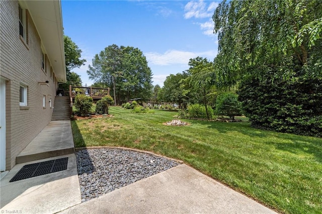 1805 Guilford College Rd, Jamestown, NC 27282 - view of grassy yard with a patio and a wooden deck
