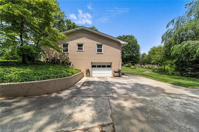 1805 Guilford College Rd, Jamestown, NC 27282 - view of home's exterior with a garage and concrete driveway