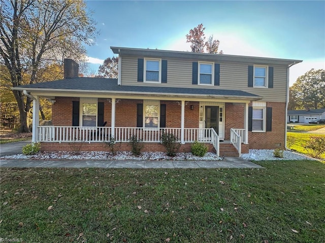 view of property with a front yard and a porch