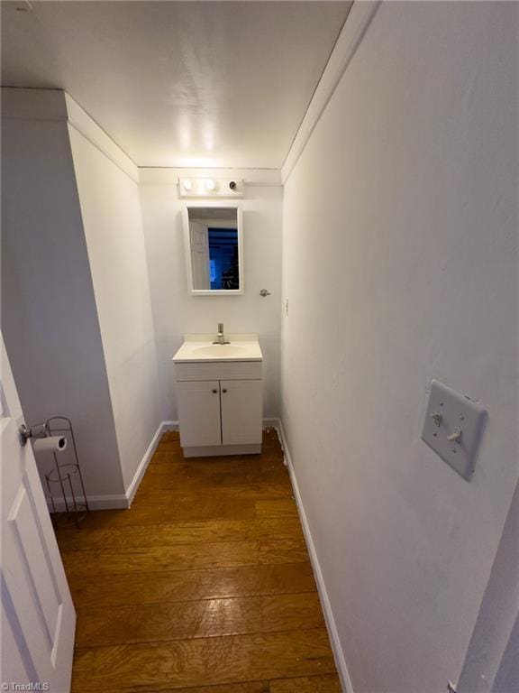 bathroom featuring hardwood / wood-style floors and vanity