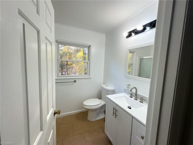 bathroom featuring tile patterned flooring, vanity, toilet, and ornamental molding