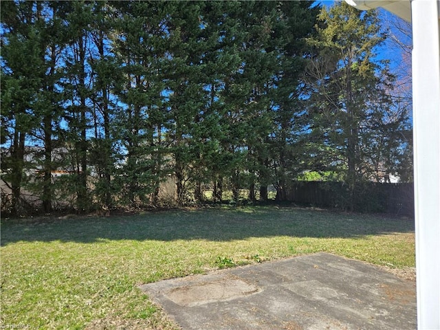 view of yard featuring a patio and fence