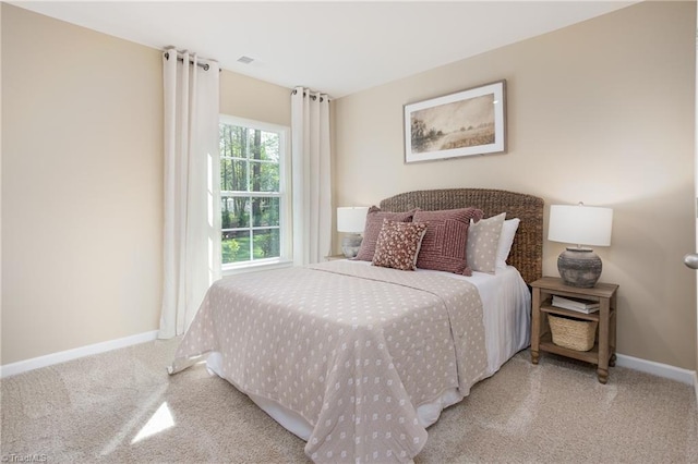 bedroom with carpet and baseboards