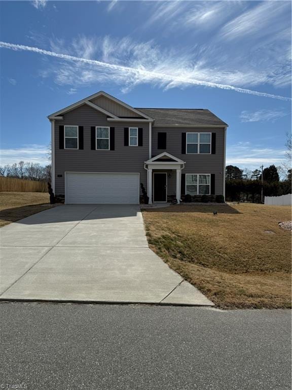 view of front facade with a garage and concrete driveway