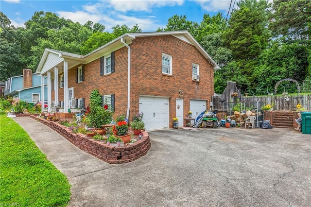 6115 Winview Heights St, Clemmons, NC 27012 - view of home's exterior featuring driveway, an attached garage, and brick siding