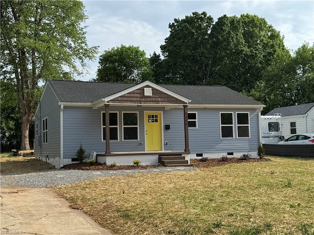 2322 Fernwood Dr, Greensboro, NC 27408 - ranch-style house with crawl space, a front lawn, a porch, and roof with shingles