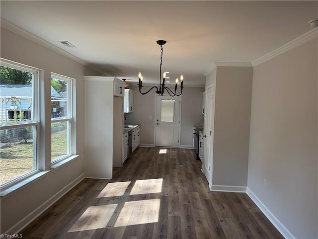 2322 Fernwood Dr, Greensboro, NC 27408 - unfurnished dining area with a chandelier, healthy amount of natural light, baseboards, crown molding, and dark wood-type flooring