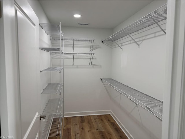2322 Fernwood Dr, Greensboro, NC 27408 - walk in closet with wood finished floors