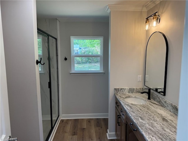 2322 Fernwood Dr, Greensboro, NC 27408 - full bath featuring vanity, wood finished floors, a marble finish shower, ornamental molding, and baseboards