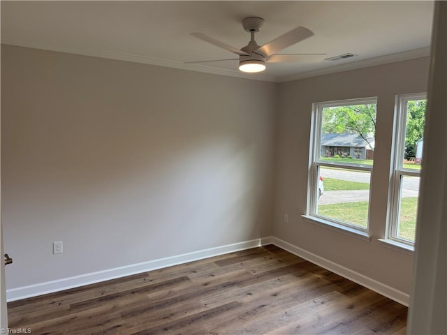 2322 Fernwood Dr, Greensboro, NC 27408 - spare room featuring crown molding, plenty of natural light, baseboards, wood finished floors, and a ceiling fan