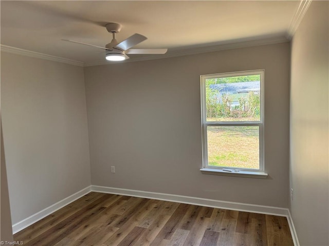 2322 Fernwood Dr, Greensboro, NC 27408 - spare room featuring crown molding, wood finished floors, baseboards, and a ceiling fan
