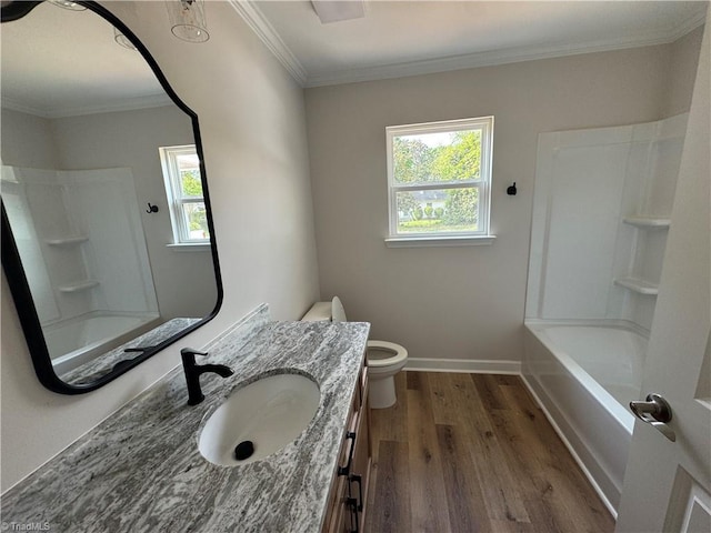 2322 Fernwood Dr, Greensboro, NC 27408 - full bath with vanity, wood finished floors, toilet, shower / tub combination, and crown molding