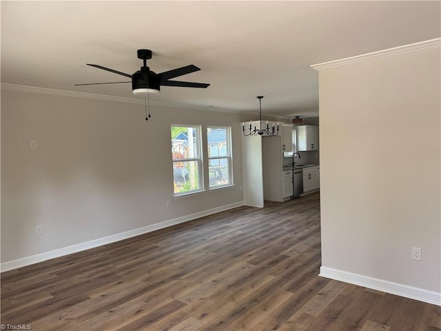 2322 Fernwood Dr, Greensboro, NC 27408 - unfurnished room featuring crown molding, a ceiling fan, a chandelier, and baseboards
