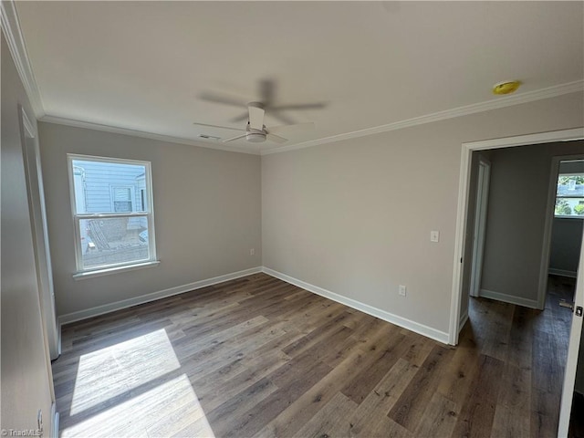 2322 Fernwood Dr, Greensboro, NC 27408 - spare room with crown molding, wood finished floors, baseboards, a ceiling fan, and a smoke detector