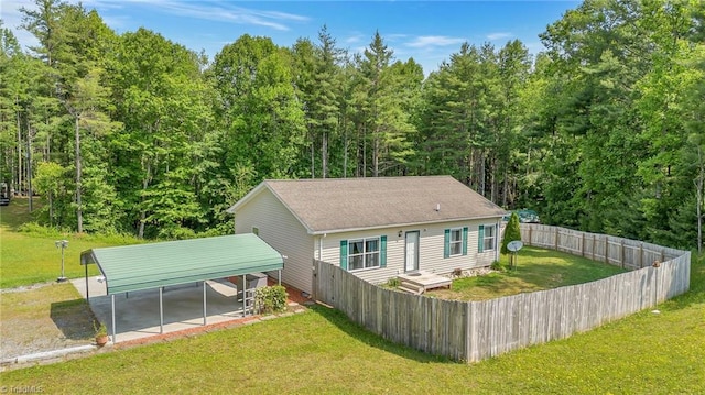 78 Arnies Ln, Sparta, NC 28675 - rear view of property with a carport, a wooded view, and a shingled roof
