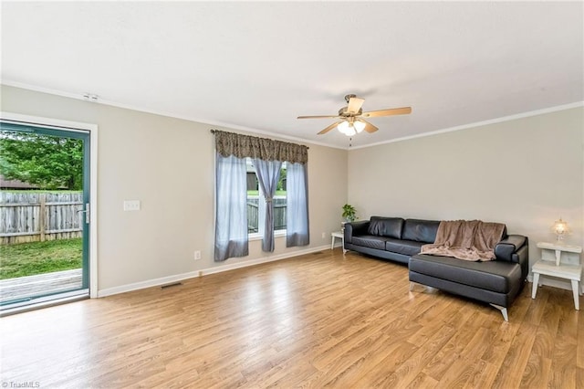 78 Arnies Ln, Sparta, NC 28675 - living area featuring plenty of natural light, light wood-type flooring, ceiling fan, baseboards, and crown molding
