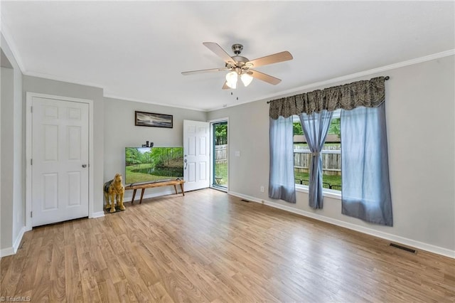 78 Arnies Ln, Sparta, NC 28675 - empty room featuring light wood-style flooring, ceiling fan, baseboards, and ornamental molding