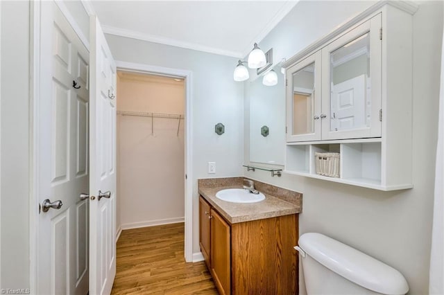 78 Arnies Ln, Sparta, NC 28675 - bathroom with vanity, wood finished floors, crown molding, toilet, and a spacious closet