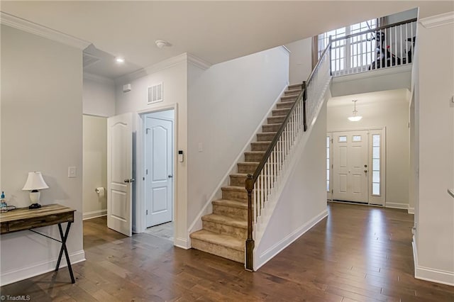 4116 Branch Point Ct, Pfafftown, NC 27040 - entrance foyer featuring ornamental molding, stairway, baseboards, wood finished floors, and recessed lighting