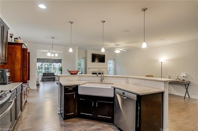 4116 Branch Point Ct, Pfafftown, NC 27040 - kitchen with appliances with stainless steel finishes, a sink, ornamental molding, ceiling fan, and open floor plan