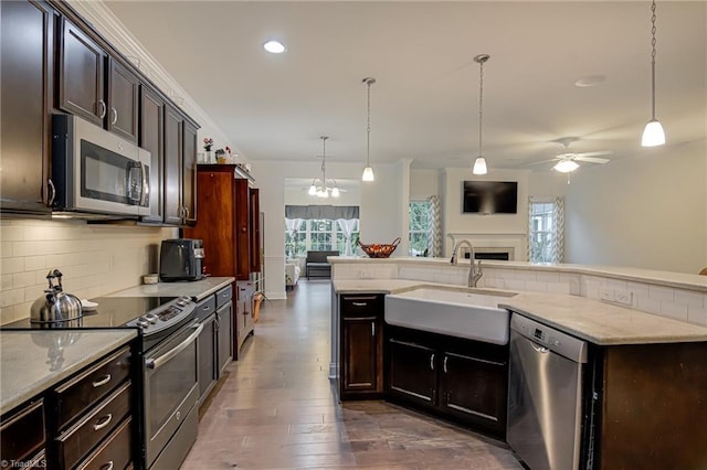 4116 Branch Point Ct, Pfafftown, NC 27040 - kitchen with stainless steel appliances, a sink, open floor plan, backsplash, and ceiling fan