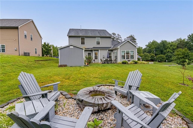 4116 Branch Point Ct, Pfafftown, NC 27040 - back of property with an outdoor fire pit, a lawn, and cooling unit