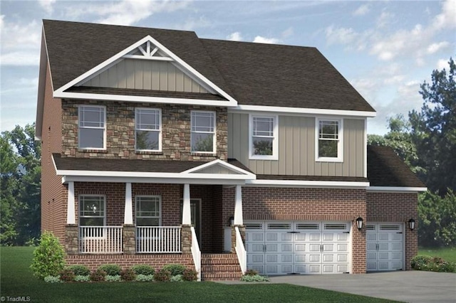 craftsman-style home featuring covered porch, a garage, and a front yard