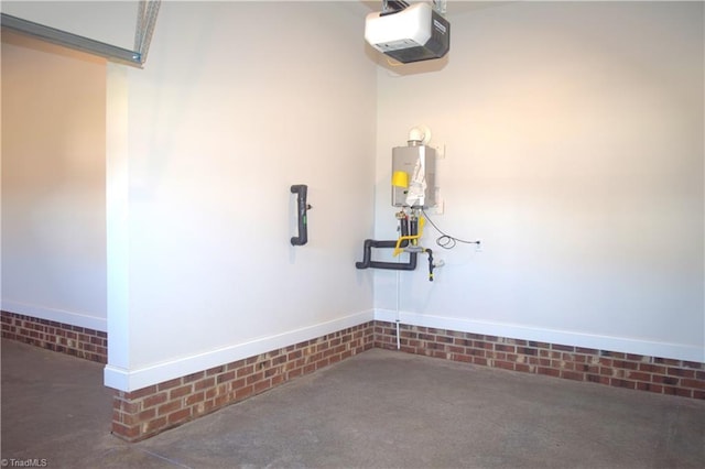 garage with tankless water heater and a garage door opener