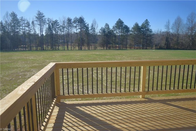 wooden deck with a yard