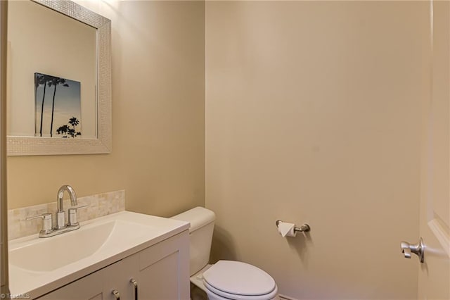 half bath with vanity and toilet