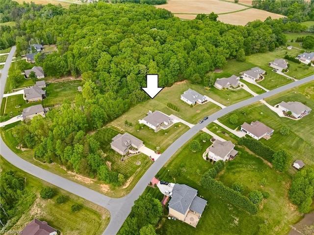 birds eye view of property with a residential view