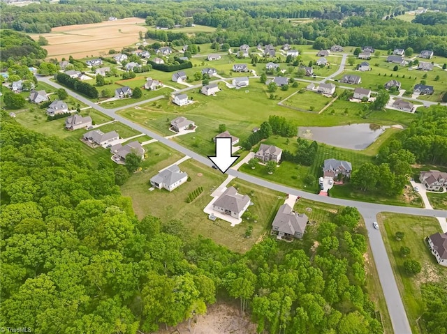 birds eye view of property featuring a residential view and a water view