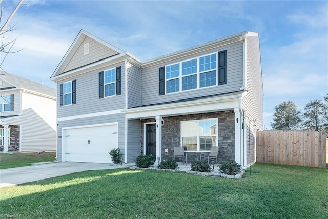 front of property featuring a garage and a front lawn