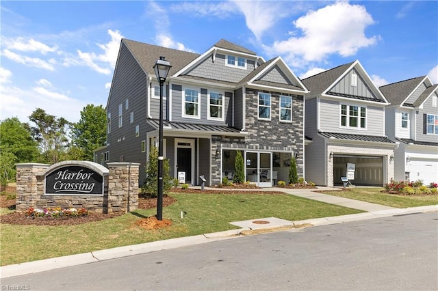 view of front of home featuring a front yard and a garage