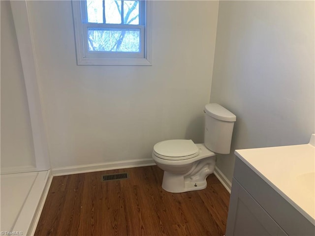 744 Caleb St, Eden, NC 27288 - bathroom featuring baseboards, wood finished floors, toilet, and vanity