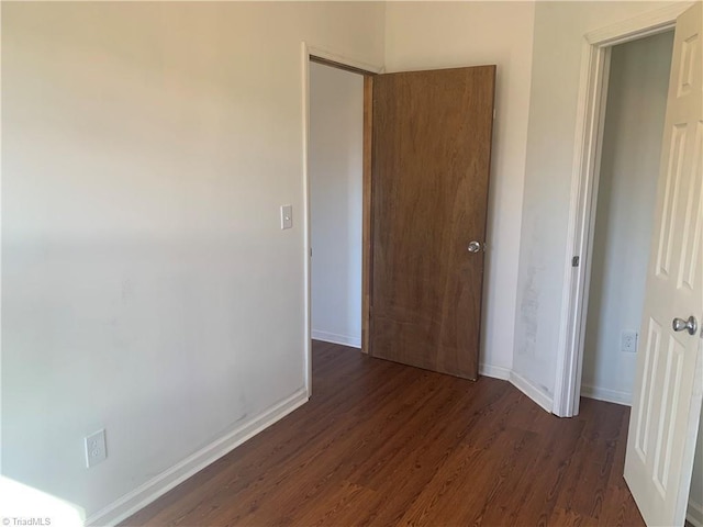 744 Caleb St, Eden, NC 27288 - unfurnished bedroom featuring wood finished floors and baseboards