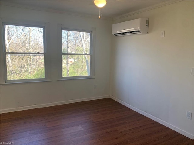 744 Caleb St, Eden, NC 27288 - empty room with a wall mounted AC, dark wood finished floors, ornamental molding, and baseboards
