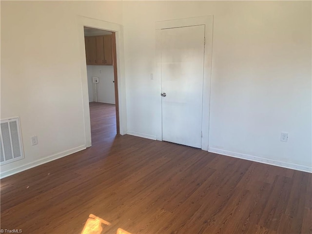 744 Caleb St, Eden, NC 27288 - spare room featuring dark wood finished floors and baseboards