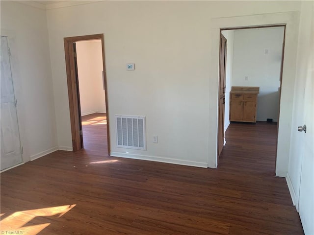 744 Caleb St, Eden, NC 27288 - spare room featuring dark wood-style flooring and baseboards