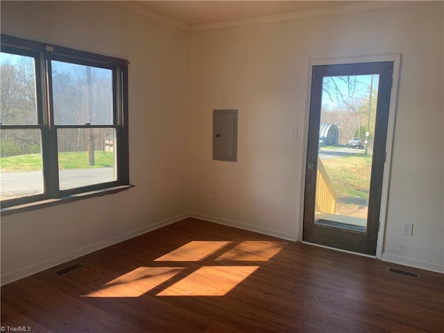 744 Caleb St, Eden, NC 27288 - unfurnished room with electric panel, wood finished floors, baseboards, and crown molding