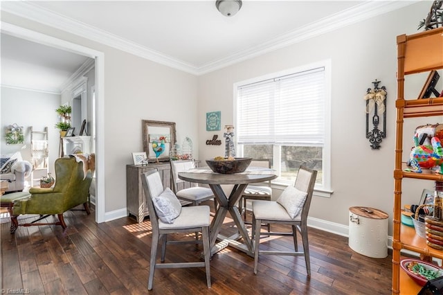 dining room with baseboards, dark wood finished floors, and ornamental molding