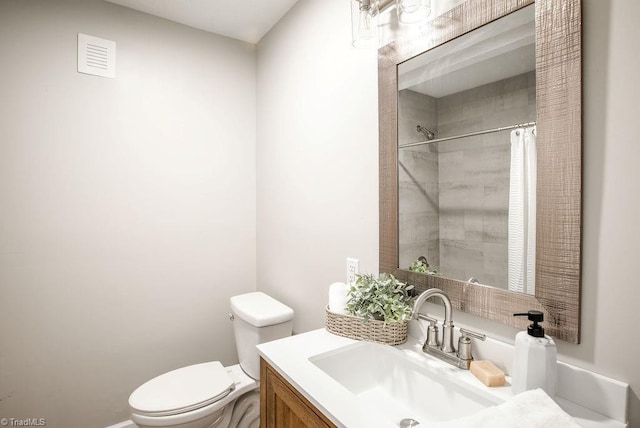 bathroom with vanity, toilet, and a shower with shower curtain