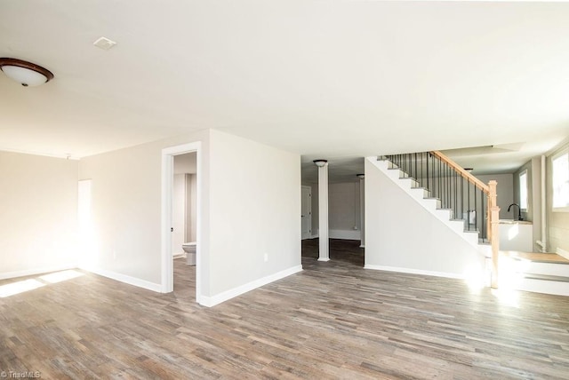 unfurnished living room with hardwood / wood-style floors