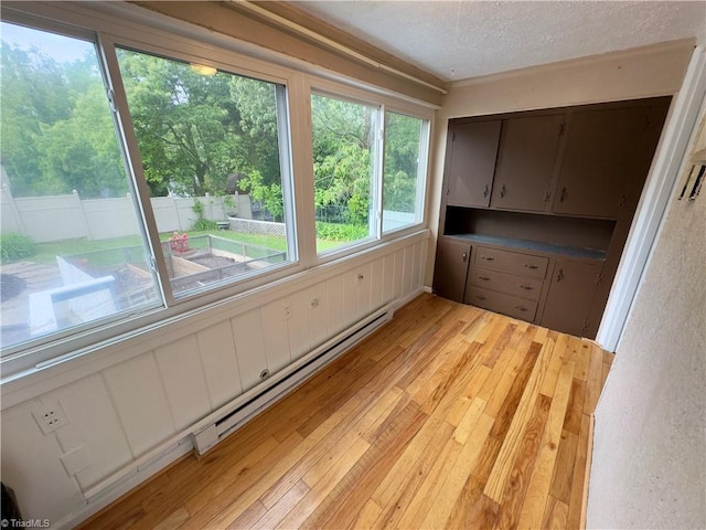 216 Rawley Ave, Mount Airy, NC 27030 - unfurnished sunroom featuring a baseboard radiator