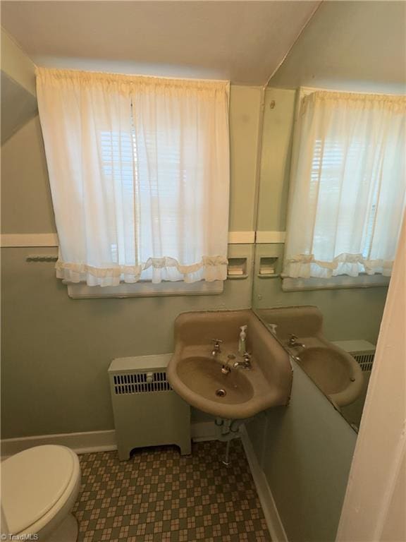 216 Rawley Ave, Mount Airy, NC 27030 - bathroom with radiator, plenty of natural light, toilet, and baseboards