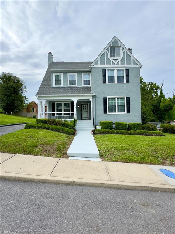 216 Rawley Ave, Mount Airy, NC 27030 - view of front facade featuring a front yard, a chimney, and a porch