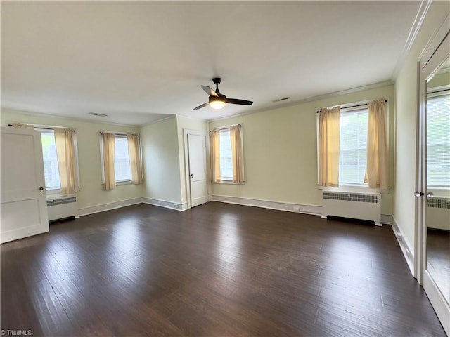 216 Rawley Ave, Mount Airy, NC 27030 - spare room with radiator heating unit, crown molding, ceiling fan, and healthy amount of natural light